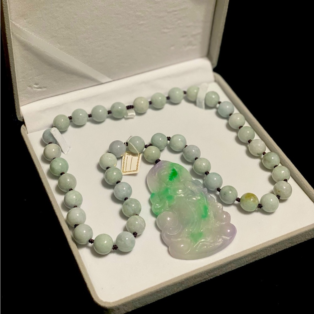 One of a kind! 26inch natural jade necklace with a 3 1/2 inch Guanyin pendant.
